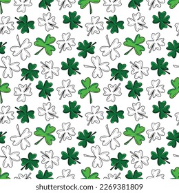 Seamless pattern with green clover isolated on white background. Hand drawn vector silhouette sketch illustration in doodle engraved vintage outline style. St. Patrick's day, lucky, botanical, plant