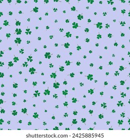 Seamless pattern green clover leaves on a purple background. holiday print. shamrock