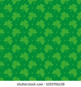 Seamless pattern of green clover on a green background.