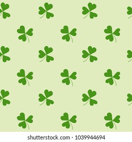 Seamless pattern with green clover on a white background