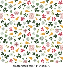 Seamless pattern with green clover, plants, leaves, decorative elements on white background