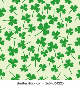 Seamless pattern with green clover  the symbol of St. Patrick's day. Vector  illustration hand drawn in doodle  on color background for design, kids decor, wrapping, textile