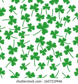 Seamless pattern with green clover  the symbol of St. Patrick's day. Vector  illustration with shamrock symbol of Ireland, hand drawn in doodle  on color background for design, kids decor, wrapping