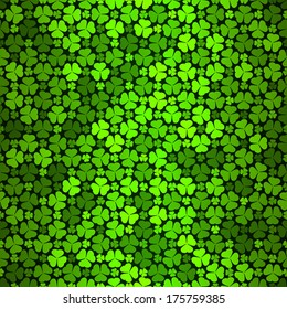 Seamless pattern with green clovers, vector background