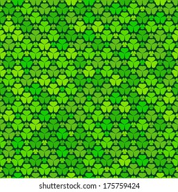 Seamless pattern with green clovers, vector background