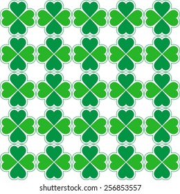 Seamless pattern of green clovers. Vector ornament.