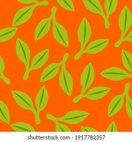Seamless pattern with green doudle leaves. Orange background. Autumn, spring or summer. Nature and ecology. For packaging design and wrapping paper. For wallpaper, scrapbooking, textile and post cards