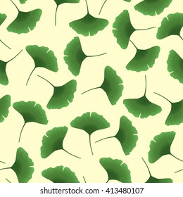 Seamless pattern with green ginkgo on yellow background