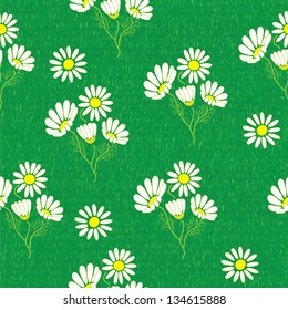 Seamless pattern with green grass field and chamomiles