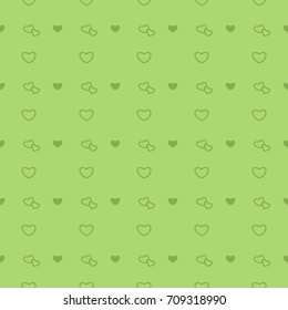 Seamless pattern with green hearts.