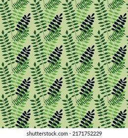 Seamless pattern of green leaves intertwined on a lettuce background.