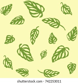 Seamless pattern of green leaves Monstera, isolated on yellow background. 