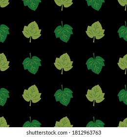 Seamless pattern of green leaves on a black background. Vector illustration. Great for use as an additional design. For decorating thematic banners, cards, prints, textiles, fabric, creatives ideas.