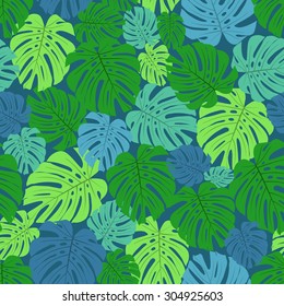 Seamless pattern with green leaves on blue background, vector illustration