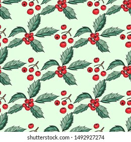 Seamless pattern with green leaves and red holly berries on the light green background. Traditional Christmas decoration. Symbol of Christmas.