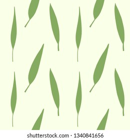 Seamless pattern with green leaves silhouettes