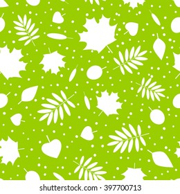 Seamless pattern with green leaves silhouettes
