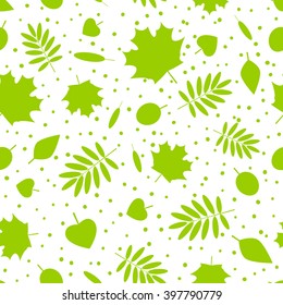 Seamless pattern with green leaves silhouettes