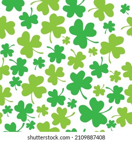 Seamless pattern with green lucky shamrock or clover leaves for St Patricks Day