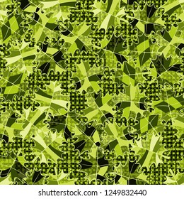 Seamless pattern. Green maple leaves on abstract texture background.