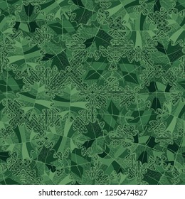 Seamless pattern. Green maple leaves on the background of the parquet pattern. Camouflage style.