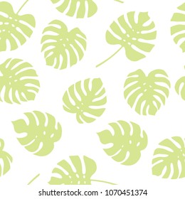 Seamless pattern of green monstera leaves. Tropical leaves of palm tree background