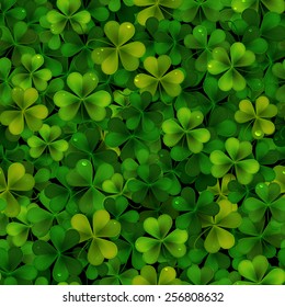 Seamless pattern with green realistic Saint Patricks day shamrock leaves