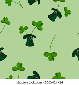 Seamless pattern of green slag and four leaf clover on a light green background for St. Patrick's Day. vector