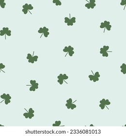 Seamless pattern with  green three-leaf clover leaves or shamrock vector. St Patrick's Day. Good luck symbol. Simple repeatable design for wrapping, wallpaper, apparel, card, phone case, paper gift.