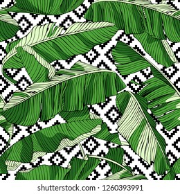 Seamless pattern. Green Tropical banana palm leaves on a geometric background. Textile composition, hand drawn style print. Vector illustration.