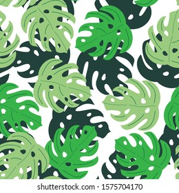 Seamless pattern with green tropical leaves