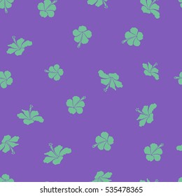 Seamless pattern in green and violet colors. Vector hand drawn painting of green and violet hibiscus flowers.