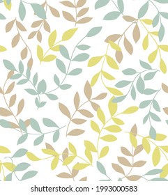 Seamless pattern of green and yellow, beige leaves. Botanical seamless pattern of delicate and stylized leaves. Wallpaper, backgrounds, textile, fabric.