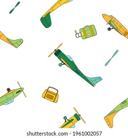 Seamless pattern with green and yellow vintage planes, travel bags and propellers in cartoon style on white background.