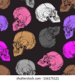 seamless pattern with grey, pink, white and brown skulls