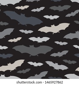 Seamless pattern with a group of bat. Halloween holiday background. Vampire silhouettes print. Trick or treat wallpaper. Kids scrapbook digital paper, textile print, page fill. Vector illustration