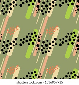 Seamless pattern of groups of dots on a green  background.
