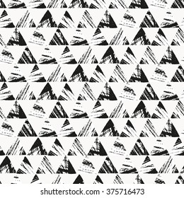 Seamless pattern with grunge black triangles