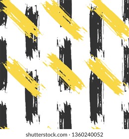 Seamless pattern with grunge black and yellow brush strokes. Hand drawn texture. Background, textile, backdrop, wrapper, fabric.