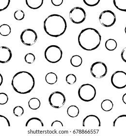 Seamless pattern with grunge circles. Hand drawn round shapes background. Black white brush stroke texture. Geometric graphic design element. Scrapbook wallpaper. Vector illustration