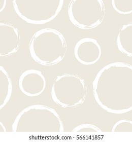 Seamless pattern with grunge hand painted circles. Hand drawn round shapes background. Beige white brush stroke texture. Geometric graphic design element. Vector illustration.
