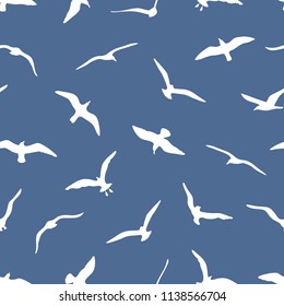 Seamless pattern with gulls on blue background. Can be used for graphic design, textile design or web design.