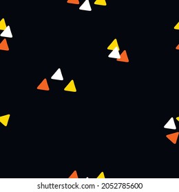 A seamless pattern of halloween candy corn abstract design on black background trendy seamless background texture fabrics wrapping paper design