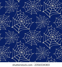 Seamless pattern of Halloween cobwebs on isolated dark blue background. Hand background for Halloween party decoration, scrapbooking, textile, greeting cards design, wall paper.