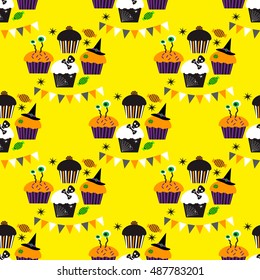 Seamless pattern with Halloween cupcakes