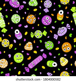 Seamless pattern for the Halloween holiday with candies and sweets. Sugar candy corn and dots on a black background. The traditional colors of the holiday are orange, green, purple