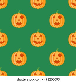 Seamless pattern with halloween pumpkins on green background. Vector texture.