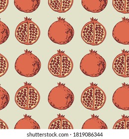 Seamless pattern of halves of pomegranate in pastel colors. Vector illustration in a flat style.
