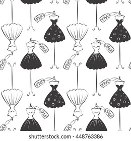 Seamless pattern hand drawing with black contour of women's dresses on a white background