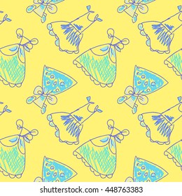 Seamless pattern hand drawing with colors bright various women's dresses on a yellow background